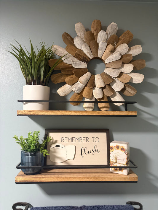 Rustic wood floating shelves with black metal rails in Better Within guest bathroom